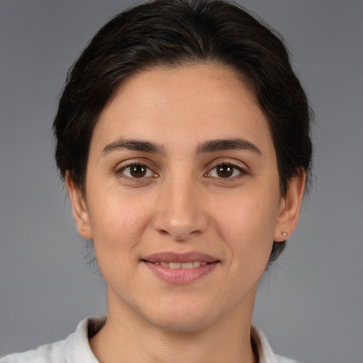 Joyful white young-adult female with medium  brown hair and brown eyes