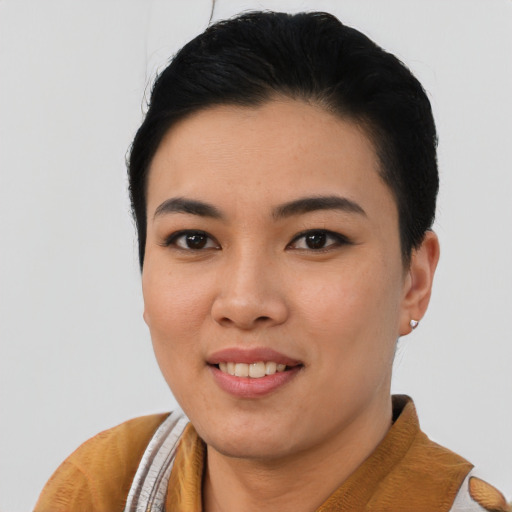Joyful asian young-adult female with short  black hair and brown eyes