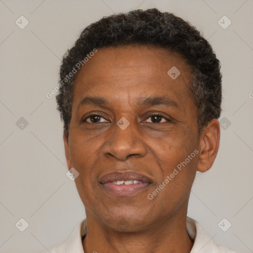 Joyful black adult male with short  brown hair and brown eyes