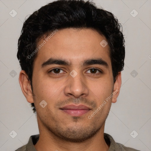 Joyful latino young-adult male with short  brown hair and brown eyes