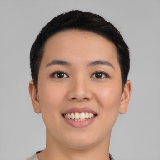 Joyful asian young-adult female with short  black hair and brown eyes