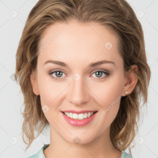 Joyful white young-adult female with medium  brown hair and green eyes