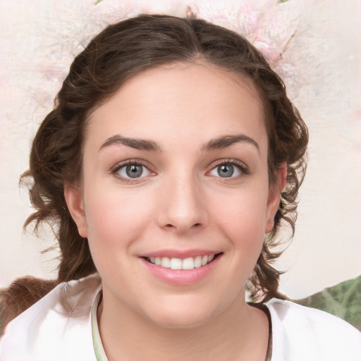 Joyful white young-adult female with medium  brown hair and green eyes