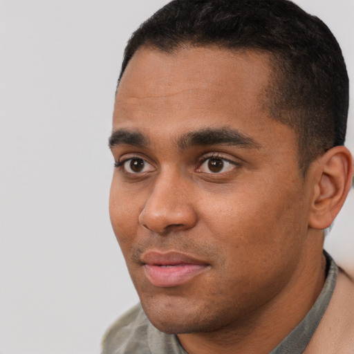 Neutral black young-adult male with short  black hair and brown eyes