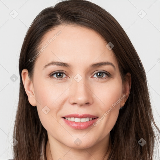 Joyful white young-adult female with long  brown hair and grey eyes