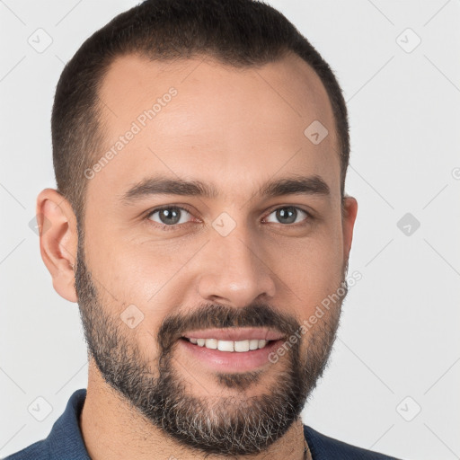 Joyful white young-adult male with short  brown hair and brown eyes