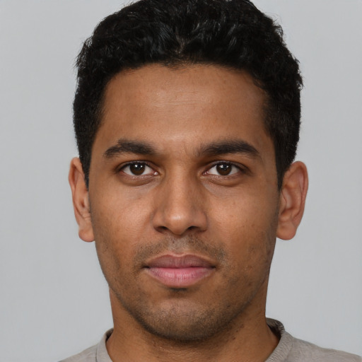 Neutral latino young-adult male with short  black hair and brown eyes