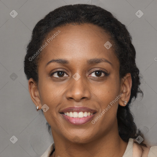 Joyful black adult female with short  black hair and brown eyes