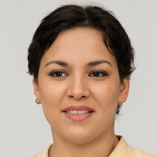Joyful asian young-adult female with short  brown hair and brown eyes