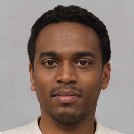 Neutral black young-adult male with short  black hair and brown eyes