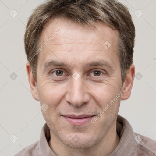 Joyful white adult male with short  brown hair and grey eyes