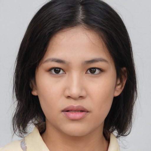 Neutral asian young-adult female with medium  brown hair and brown eyes