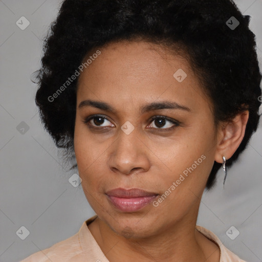 Joyful black adult female with short  brown hair and brown eyes