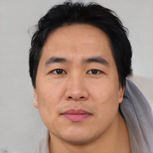Neutral asian young-adult male with short  black hair and brown eyes