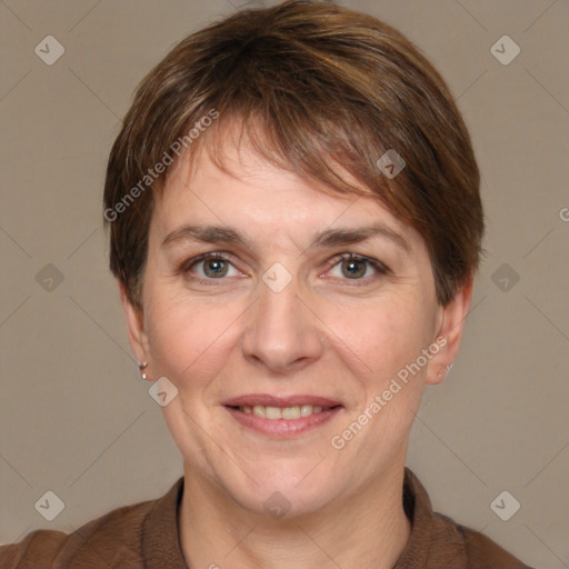 Joyful white adult female with short  brown hair and grey eyes