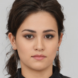 Neutral white young-adult female with medium  brown hair and brown eyes