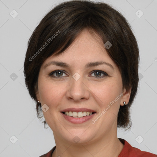 Joyful white young-adult female with medium  brown hair and grey eyes