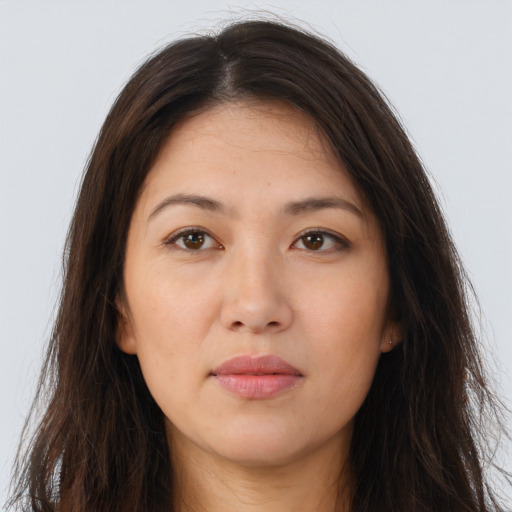 Joyful white young-adult female with long  brown hair and brown eyes