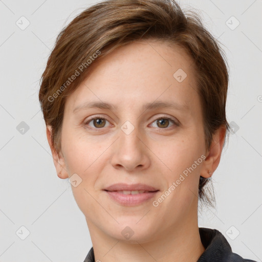 Joyful white young-adult female with short  brown hair and grey eyes