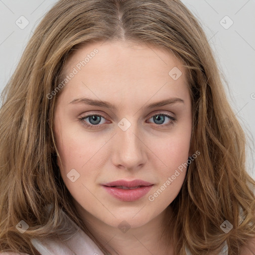 Joyful white young-adult female with long  brown hair and blue eyes