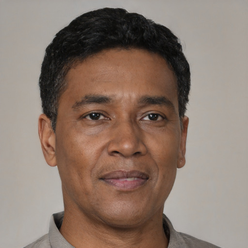 Neutral latino adult male with short  black hair and brown eyes