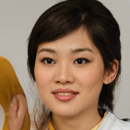 Joyful asian young-adult female with medium  brown hair and brown eyes