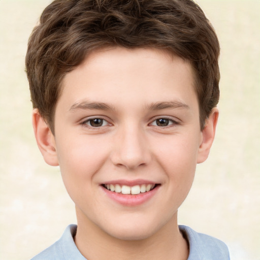 Joyful white child male with short  brown hair and brown eyes