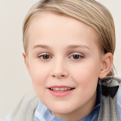 Joyful white child female with short  brown hair and blue eyes