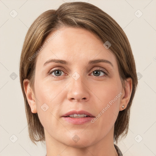 Joyful white adult female with medium  brown hair and grey eyes