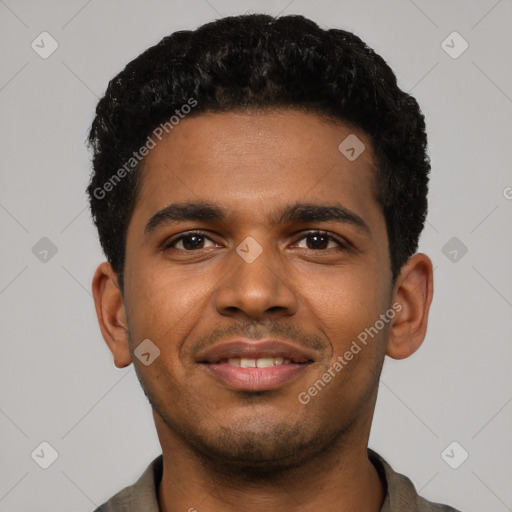 Joyful black young-adult male with short  black hair and brown eyes