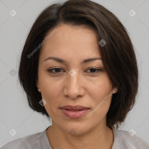 Joyful asian adult female with medium  brown hair and brown eyes