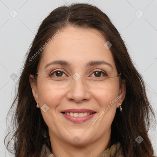 Joyful white adult female with long  brown hair and brown eyes