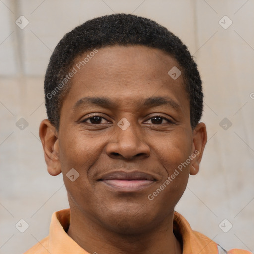 Joyful black young-adult male with short  brown hair and brown eyes