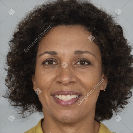 Joyful black adult female with medium  brown hair and brown eyes