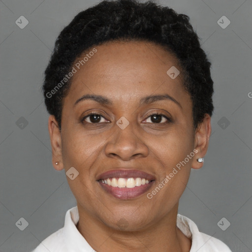 Joyful black adult female with short  brown hair and brown eyes