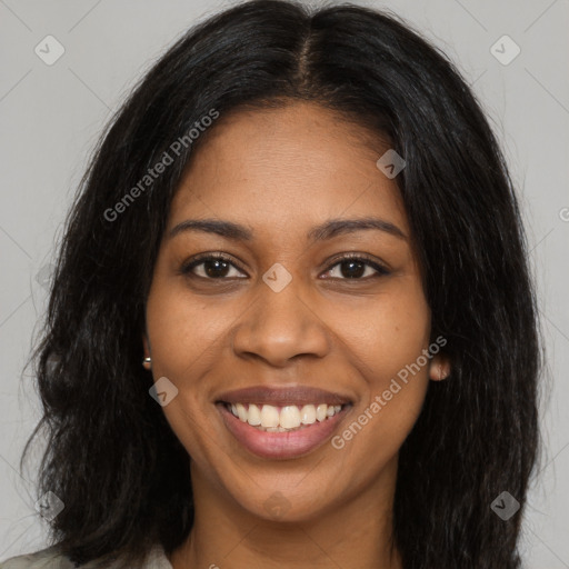 Joyful black young-adult female with long  brown hair and brown eyes