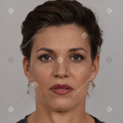 Joyful white adult female with short  brown hair and brown eyes