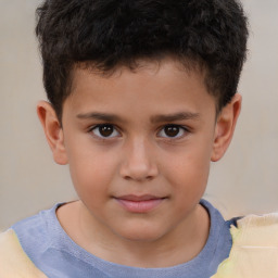 Joyful white child male with short  brown hair and brown eyes