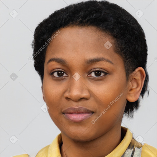 Joyful black young-adult female with short  black hair and brown eyes