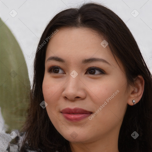 Joyful asian young-adult female with long  brown hair and brown eyes