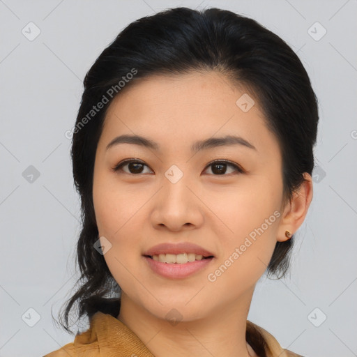 Joyful asian young-adult female with medium  black hair and brown eyes