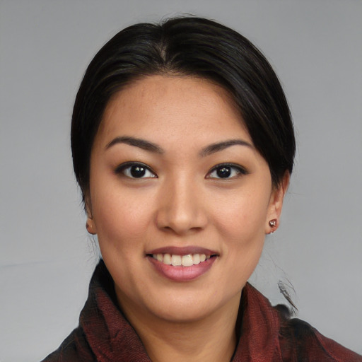 Joyful asian young-adult female with medium  brown hair and brown eyes