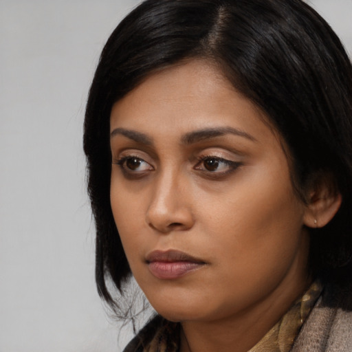 Neutral asian young-adult female with medium  black hair and brown eyes