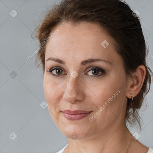 Joyful white adult female with medium  brown hair and brown eyes