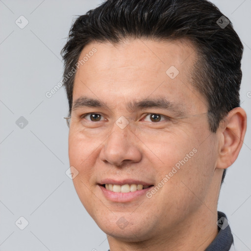 Joyful white adult male with short  brown hair and brown eyes