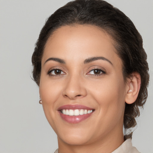 Joyful white young-adult female with medium  brown hair and brown eyes