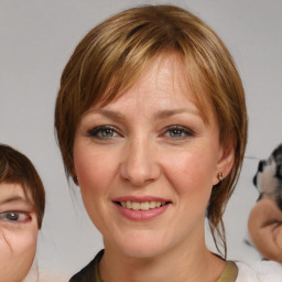 Joyful white young-adult female with medium  brown hair and blue eyes