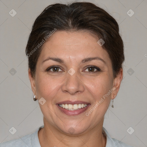 Joyful white adult female with short  brown hair and brown eyes