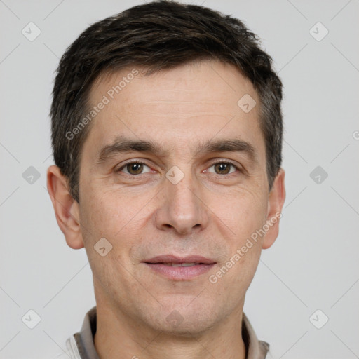 Joyful white adult male with short  brown hair and brown eyes