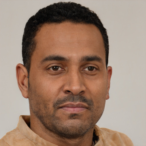 Neutral latino adult male with short  black hair and brown eyes